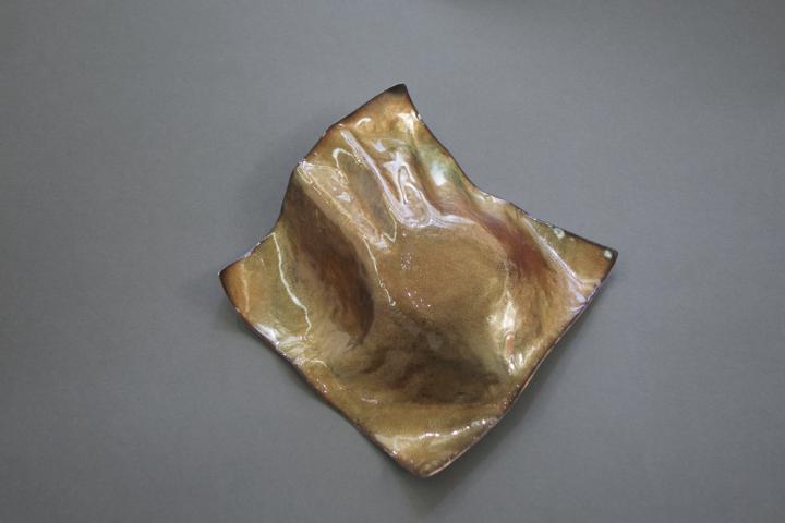 reverse side of hand formed copper bowl