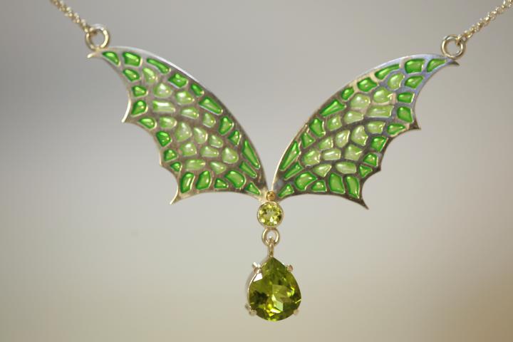 Silver bat wings and peridot